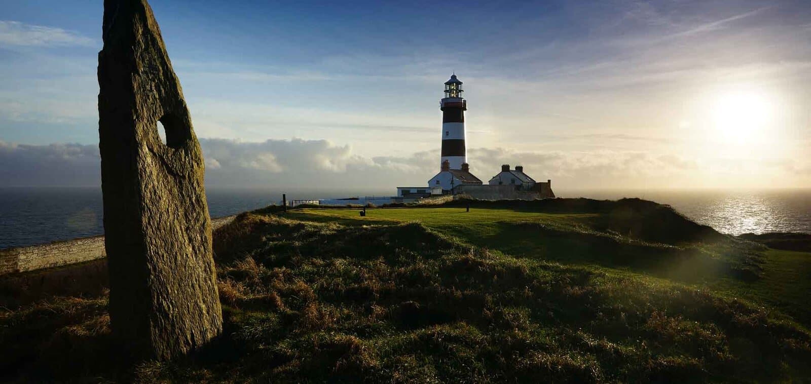 Old Head Golf Links and its lighthouse at sunset